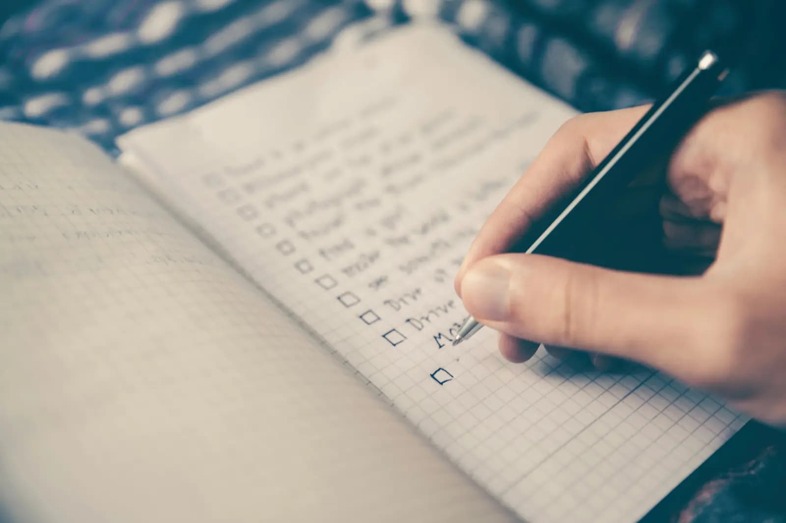 Event planner writing a checklist before a celebration