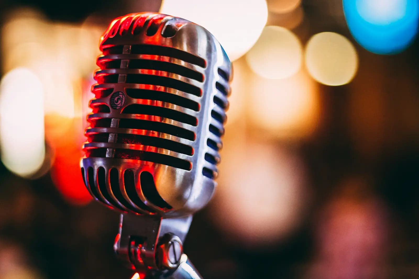 Stand-up comedian performing under stage lights